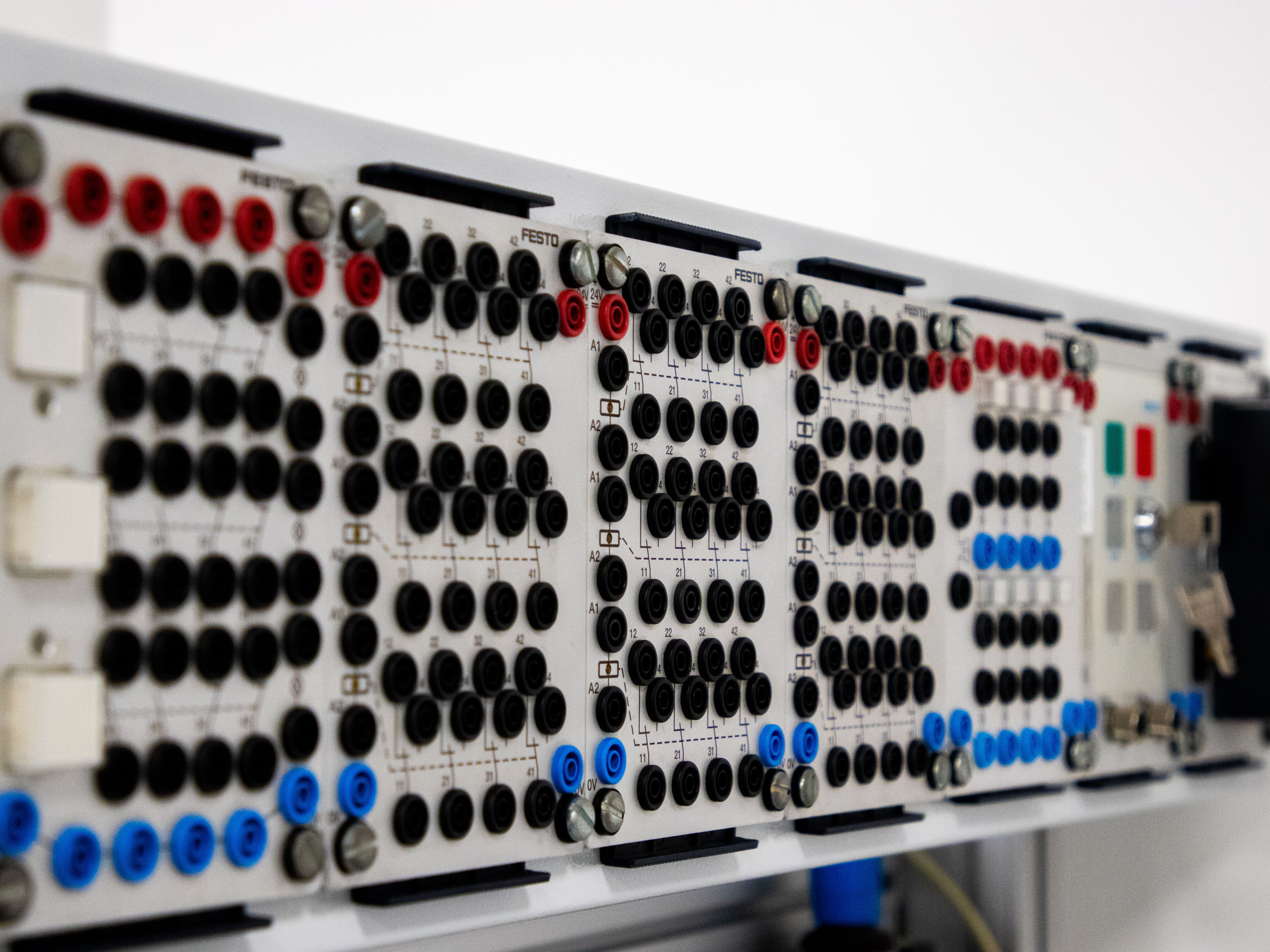 Detailed image of a modern industrial control panel featuring multiple connectors and buttons.